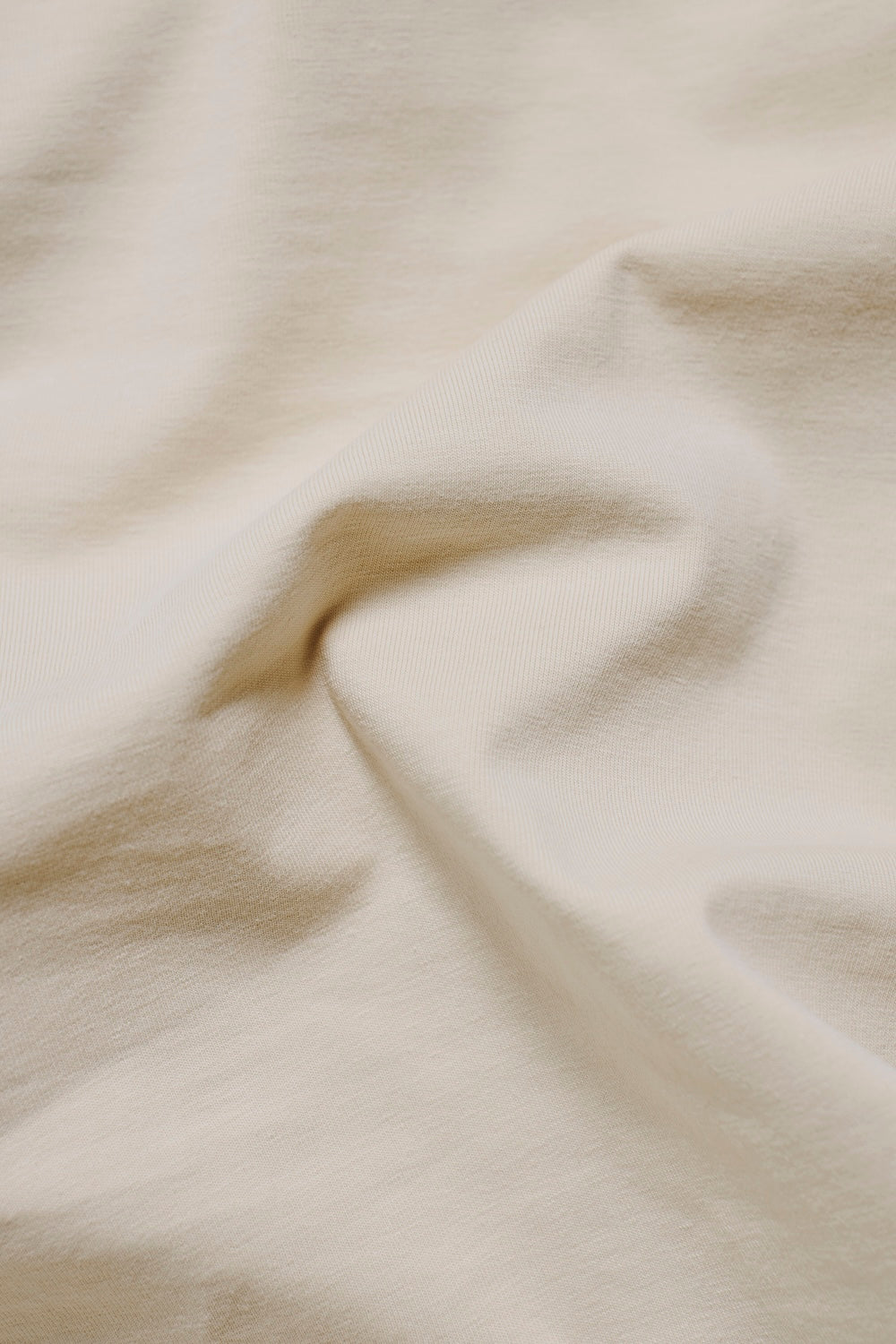 Essential Jersey Buttonless Polo Shirt in Alabaster - TAILORED ATHLETE - USA